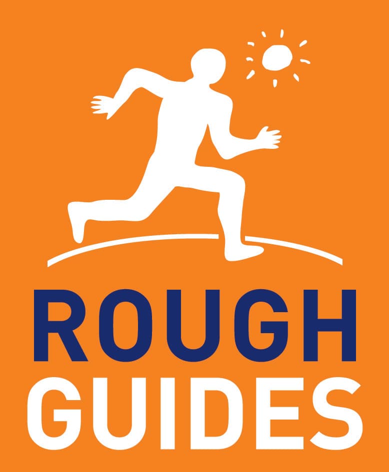 An orange and white sign with a running, that says "Rough Guides"