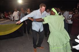 Prince Harry dancing with a local Belizean woman